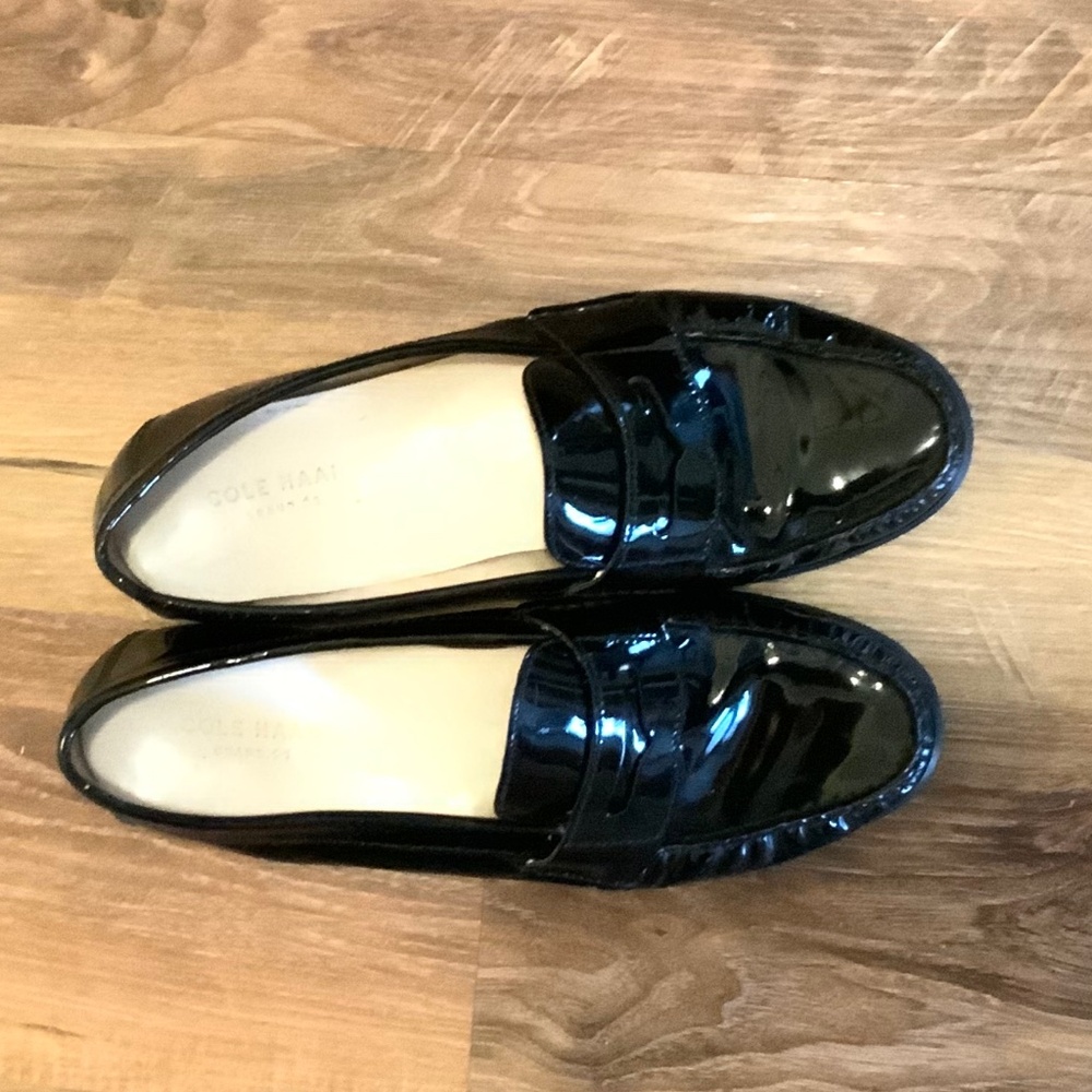 Black penny loafers by Cole Haan